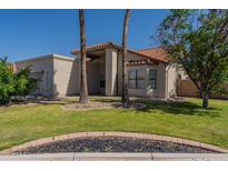 Charming single-story home with a red tile roof and well-maintained lawn at 1109 E San Pedro Ave, Gilbert, AZ 85234