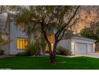 Beautiful two-story home with a well-manicured lawn and attached three-car garage at 1421 W Saltsage Dr, Phoenix, AZ 85045