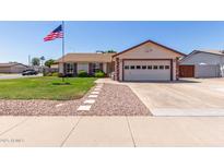 Charming single-Gathering home featuring a well-manicured lawn and an attached two-car garage at 2003 W Tyson St, Chandler, AZ 85224