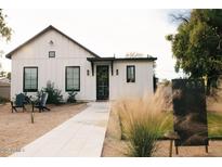 Charming home featuring a modern farmhouse design, landscaped front yard, and welcoming entrance at 419 W 11Th St, Tempe, AZ 85281