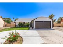 Charming single-story home featuring a well-manicured lawn and attached two car garage at 7231 W Sierra Vista Dr, Glendale, AZ 85303