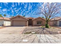Charming single-story home with well-maintained landscaping and a cozy, inviting facade at 901 N Quartz St, Gilbert, AZ 85234