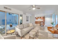 Bright living room with sliding glass doors to patio and open to kitchen at 1241 E Medlock Dr # 112, Phoenix, AZ 85014