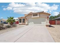 Charming single-Gathering home with a two-car garage and well-maintained desert landscaping at 12626 W Windsor Ave, Avondale, AZ 85392