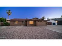Charming single-level home featuring a low maintenance front yard and a two car garage at 2337 E Riviera Dr, Tempe, AZ 85282