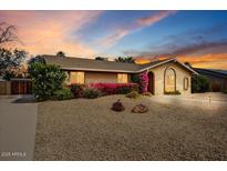 Charming single-story home featuring mature landscaping, desert landscaping, and a well-maintained exterior at 2846 E Lupine Ave, Phoenix, AZ 85028