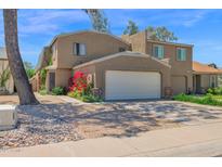Charming two-story home featuring a two-car garage and mature landscaping at 2941 E Nisbet Ct, Phoenix, AZ 85032