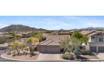 Stunning home exterior with mountain views and three-car garage in a desirable neighborhood at 3544 N Paseo Del Sol --, Mesa, AZ 85207