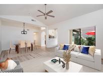 Bright, open-concept living room featuring modern furnishings and plenty of natural light at 7565 N Vía De La Siesta --, Scottsdale, AZ 85258