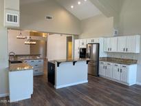 Bright kitchen boasts stainless steel appliances, granite countertops, and center island at 8136 E Cortez Dr, Scottsdale, AZ 85260