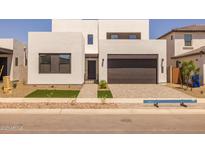 Modern two-story home with a well-maintained front yard and a two-car garage at 10236 E Utah Ave, Mesa, AZ 85212