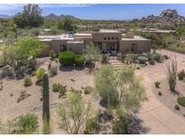 Stunning exterior view of desert home with mature landscaping and private driveway at 1401 E Boulder Pass Pass, Carefree, AZ 85377