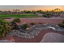 Backyard view features lush landscaping, attractive water feature and scenic views of the golf course at 22208 N San Ramon Dr, Sun City West, AZ 85375