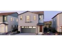 Charming two-story home with a neutral color palette, a gray garage door, and a cozy front porch at 2486 W Rowel Rd, Phoenix, AZ 85085