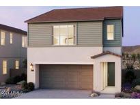 Charming two-story home featuring a two-car garage and a welcoming entrance at 2486 W Rowel Rd, Phoenix, AZ 85085