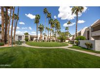 Exterior view showcasing the lush landscaping and community spaces, highlighting the serene ambiance at 7350 N Via Paseo Del Sur -- # O202, Scottsdale, AZ 85258