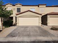 Charming townhome featuring a two-car garage, desert landscaping and a tile roof at 125 S 56Th St # 75, Mesa, AZ 85206