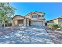 Charming two-story home with a covered porch and a two-car garage and low maintenance landscaping at 16112 W Durango St, Goodyear, AZ 85338