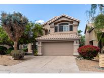 Charming two-story home featuring a well-maintained lawn, desert plants, and a neutral color palette at 236 W Calle Monte Vista Dr, Tempe, AZ 85284
