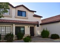 Charming townhome featuring a red tile roof and cozy front entrance at 2941 N Oregon St # 12, Chandler, AZ 85225