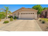 Charming single-story home featuring a well-maintained front yard and attached two-car garage at 3175 E Merrill Ave, Gilbert, AZ 85234