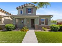 Charming two-story home with a well-maintained lawn and a welcoming front porch at 3881 E Galveston St, Gilbert, AZ 85295
