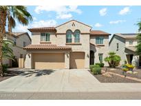 Charming two-story home with a terracotta roof and a well-maintained three-car garage at 5136 W Trotter Trl, Phoenix, AZ 85083