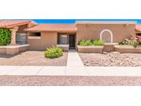 Charming single-story home with desert landscaping, tiled roof, and walkway to the front door at 520 W Hononegh Dr # 2, Phoenix, AZ 85027
