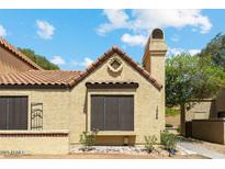 Charming home exterior featuring a tile roof and stucco facade, showcasing a cozy and inviting design at 5704 E Aire Libre Ave # 1246, Scottsdale, AZ 85254
