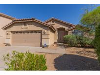 Charming single-story home with a well-maintained front yard and a two-car garage in a sunny setting at 10431 E Morning Star Dr, Scottsdale, AZ 85255