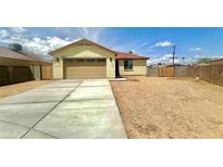 Charming single-story home featuring a neutral color, two-car garage, and a well-kept driveway at 11216 W Apache St, Avondale, AZ 85323