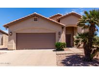Charming single-Gathering home showcasing a well-maintained front yard and an attached two-car garage at 1245 E Emile Zola Ave, Phoenix, AZ 85022