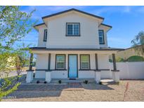 Charming two-story home featuring a light blue front door and a welcoming covered porch at 16875 N 12Th St # 31, Phoenix, AZ 85022