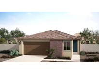Charming single-story home with a two-car garage, brick accent, and low maintenance desert landscaping at 18174 W Larkspur Dr, Goodyear, AZ 85338