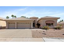 Charming single-story home featuring a three-car garage and desert landscaping for low-maintenance appeal at 1896 E Stephens Dr, Tempe, AZ 85283