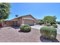 Charming single-story home with a two-car garage, desert landscaping, and a well-maintained exterior at 1983 W Allens Peak Rd, Queen Creek, AZ 85144