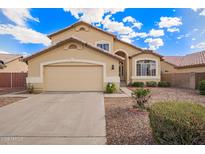 Inviting single-Gathering home features a neutral color palette, two car garage, and low maintenance landscaping at 2327 E Edna Ave, Phoenix, AZ 85022