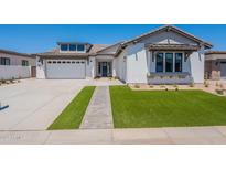 Beautiful single-Gathering home with a well-manicured lawn and a neutral color scheme at 24022 S 218Th Pl, Queen Creek, AZ 85142