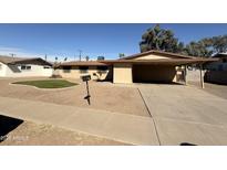 Charming one-story home featuring a covered parking area, low maintenance yard, and neutral color palette at 3434 W Augusta Ave, Phoenix, AZ 85051