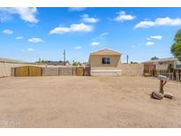 A charming single story home with a desert landscaped front yard and visible mailbox at 633 S 96Th St, Mesa, AZ 85208