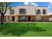 Charming townhome with tidy front yard, and well-maintained facade at 6743 S Jentilly Ln, Tempe, AZ 85283