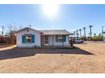 Charming single-story home with desert landscaping and inviting covered entry at 813 N Gilbert Ave, Casa Grande, AZ 85122