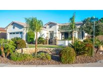 Charming single-story home with desert landscaping, stone accents, and a welcoming front entrance at 9721 E Juanita Ave, Mesa, AZ 85209