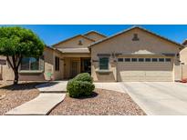 Charming single-story home featuring a well-manicured lawn and desert landscaping at 1022 N Kirby St, Gilbert, AZ 85234
