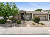 Charming single-story home featuring a desert landscaped front yard and tiled roof at 26271 N 46Th St, Phoenix, AZ 85050