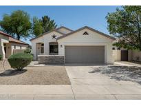 Charming single-story home with a two-car garage and desert landscaping at 2641 E Brooks St, Gilbert, AZ 85296