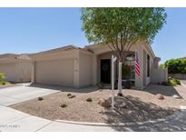 Charming single-story home featuring a neutral color palette, two-car garage, and manicured desert landscaping at 3105 E Amber Ridge Way, Phoenix, AZ 85048