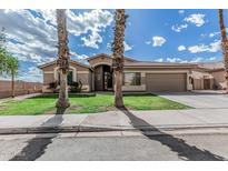Charming single-story home featuring a well-maintained lawn and desert landscaping at 408 N Falcon Ct, Gilbert, AZ 85234