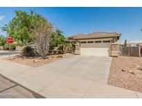 Charming single-Gathering home featuring a two-car garage, desert landscaping, and a well-maintained front yard at 44574 W High Desert Trl, Maricopa, AZ 85139
