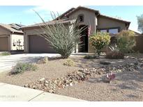 Charming single Gathering home with drought resistant landscaping including beautiful desert plants and gravel at 4601 W Fortune Dr, Anthem, AZ 85086